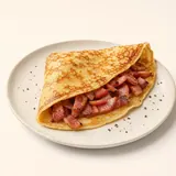 Omelette tipo "crêpes" al lardo, preparato