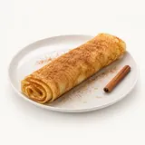 Crêpe fine au sucre et cannelle, préparée